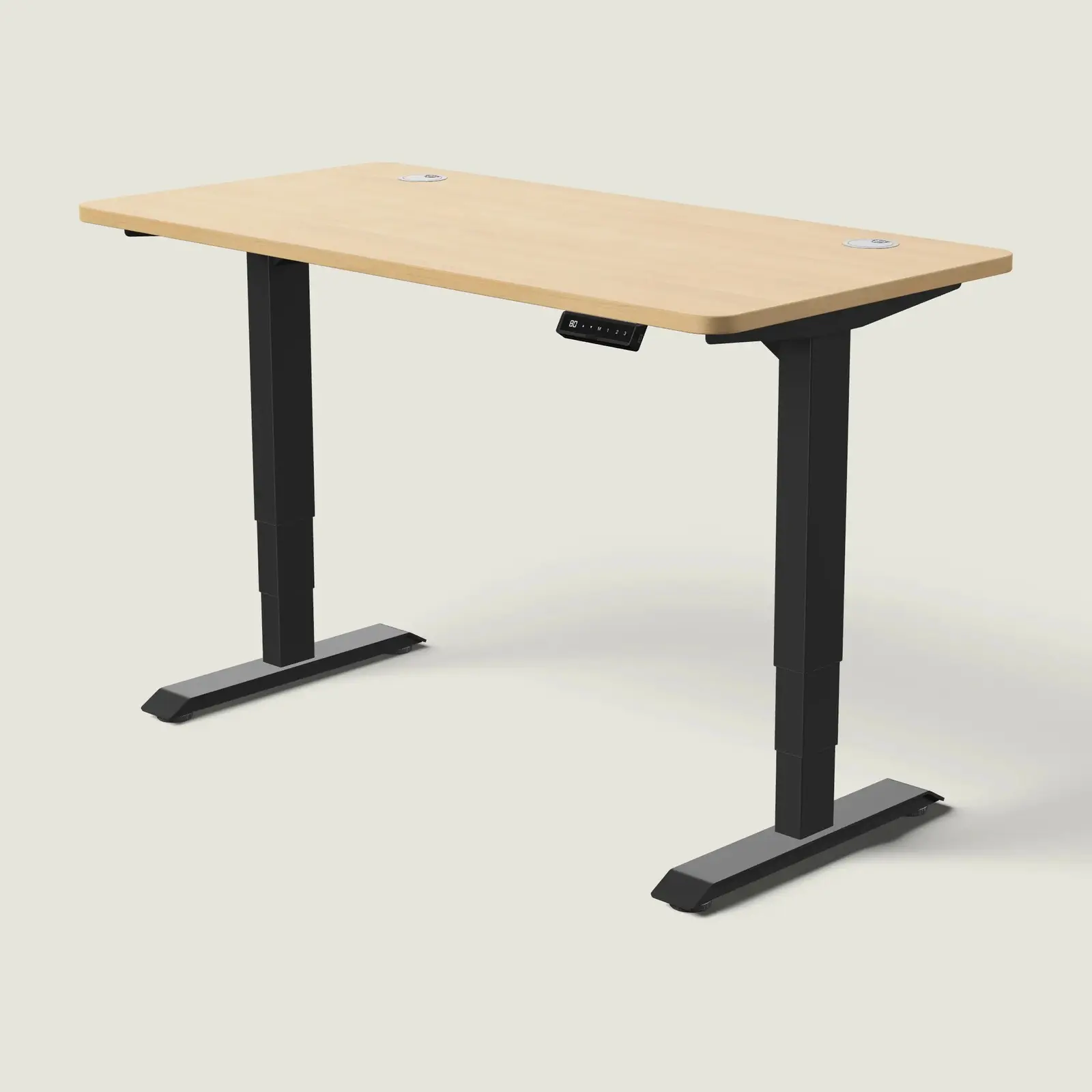 Electric standing desk, 140 × 70 cm, black frame and oak-effect top, with the memory handset under the front edge, on a pale grey background