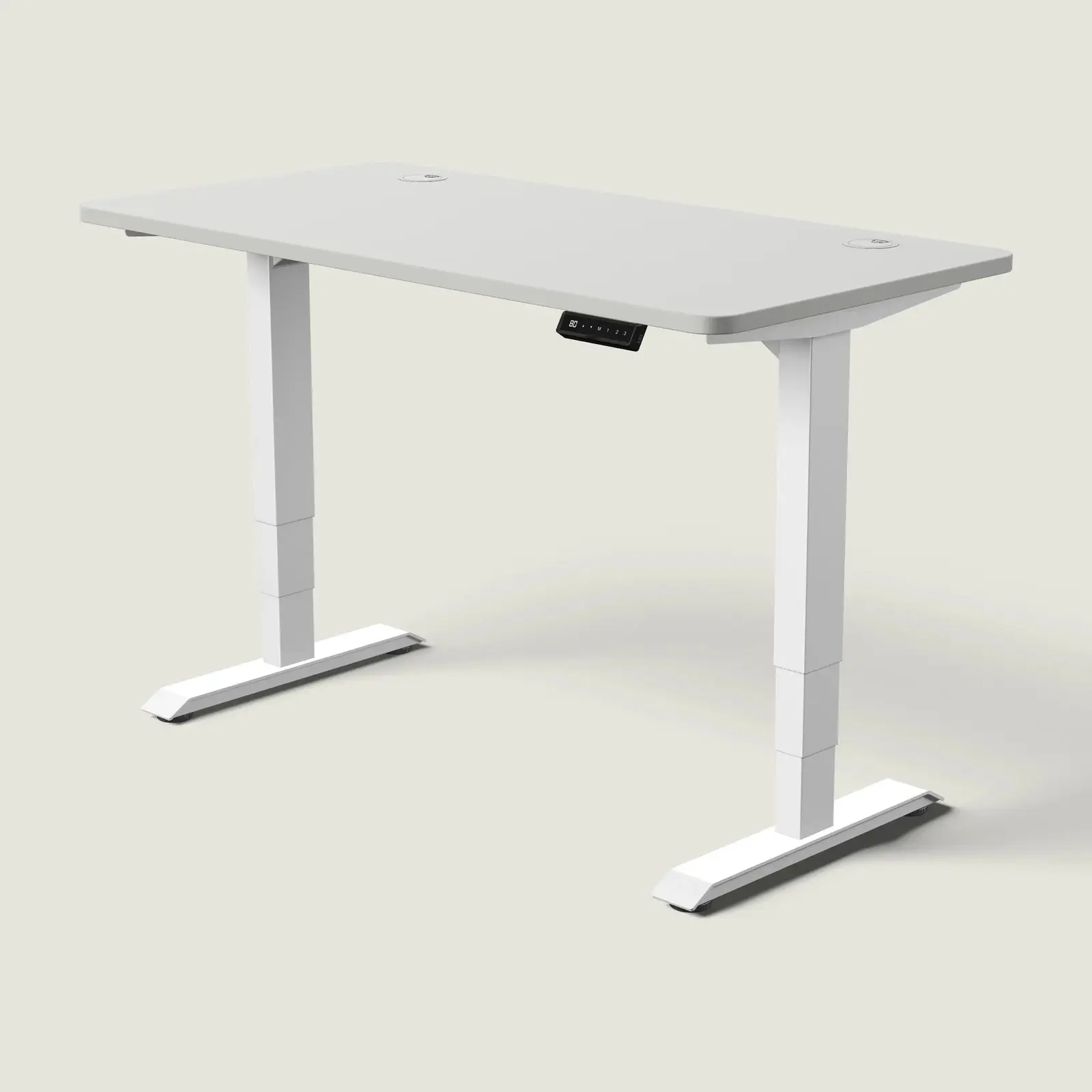 Electric standing desk, 140 × 70 cm, white frame and grey top, with the memory handset under the front edge, on a pale grey background