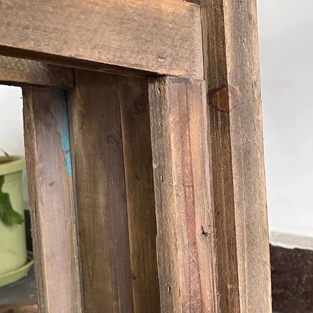Close-up of the corner joint of a rustic fir wood stool